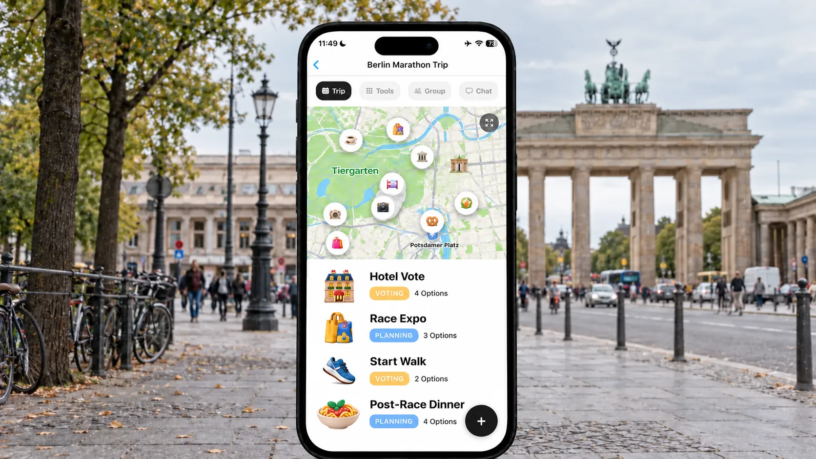 FlowTrip Berlin Marathon hotel plan on a phone beside Tiergarten and the Brandenburg Gate