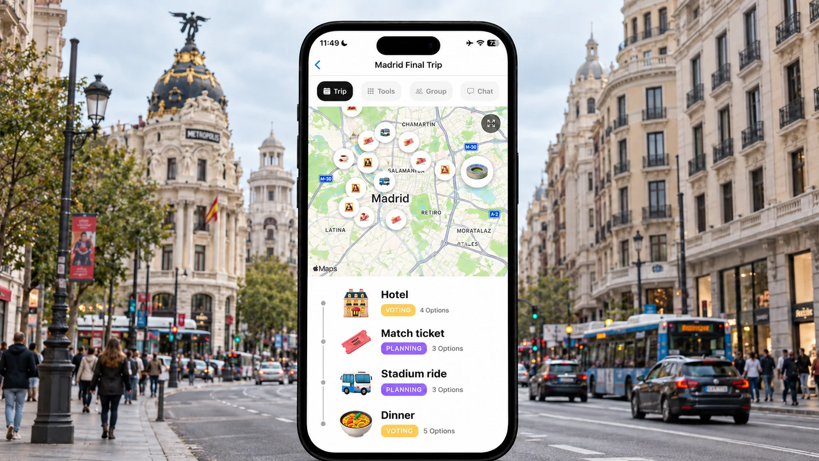 FlowTrip Madrid final trip planning screen on a phone in a Gran Vía street scene